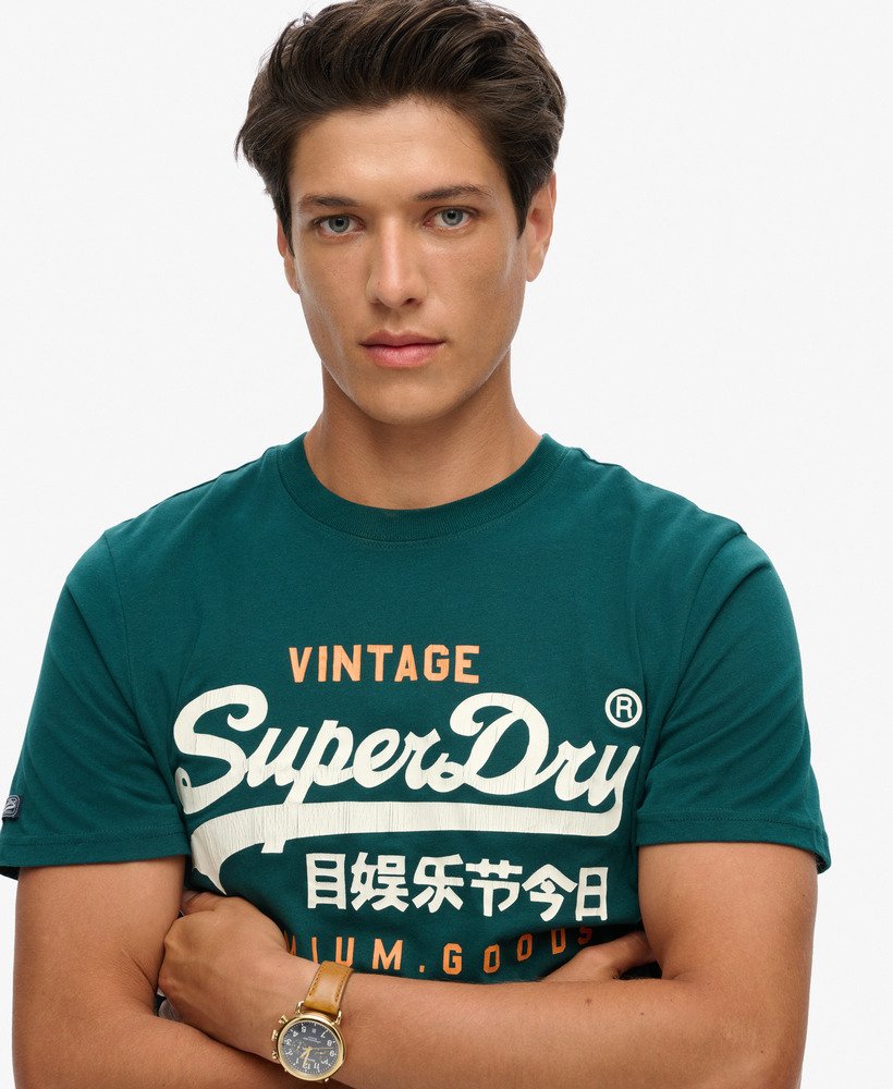 クラシックなヴィンテージロゴヘリテージtシャツ(パイングリーン)