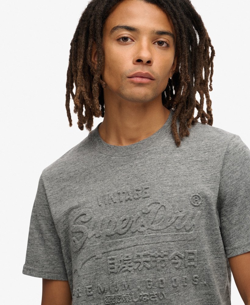 サープラスジェッター チャコールグリットのエンボスグラフィックtシャツ