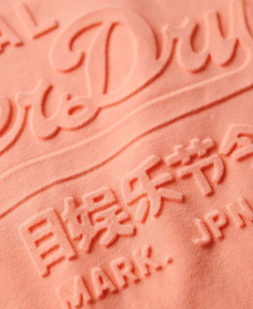 パパイヤパンチピンクのエンボス加工リラックスtシャツ